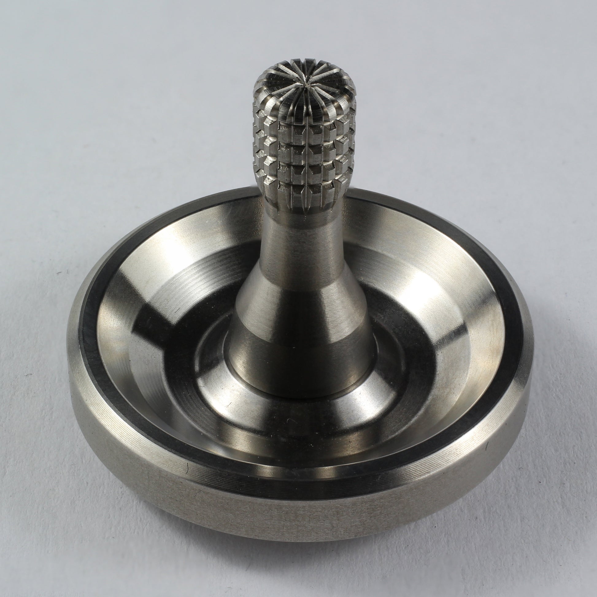 Spinoff stainless steel spinning top