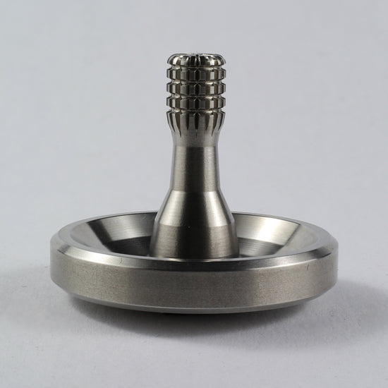 Spinoff stainless steel spinning top
