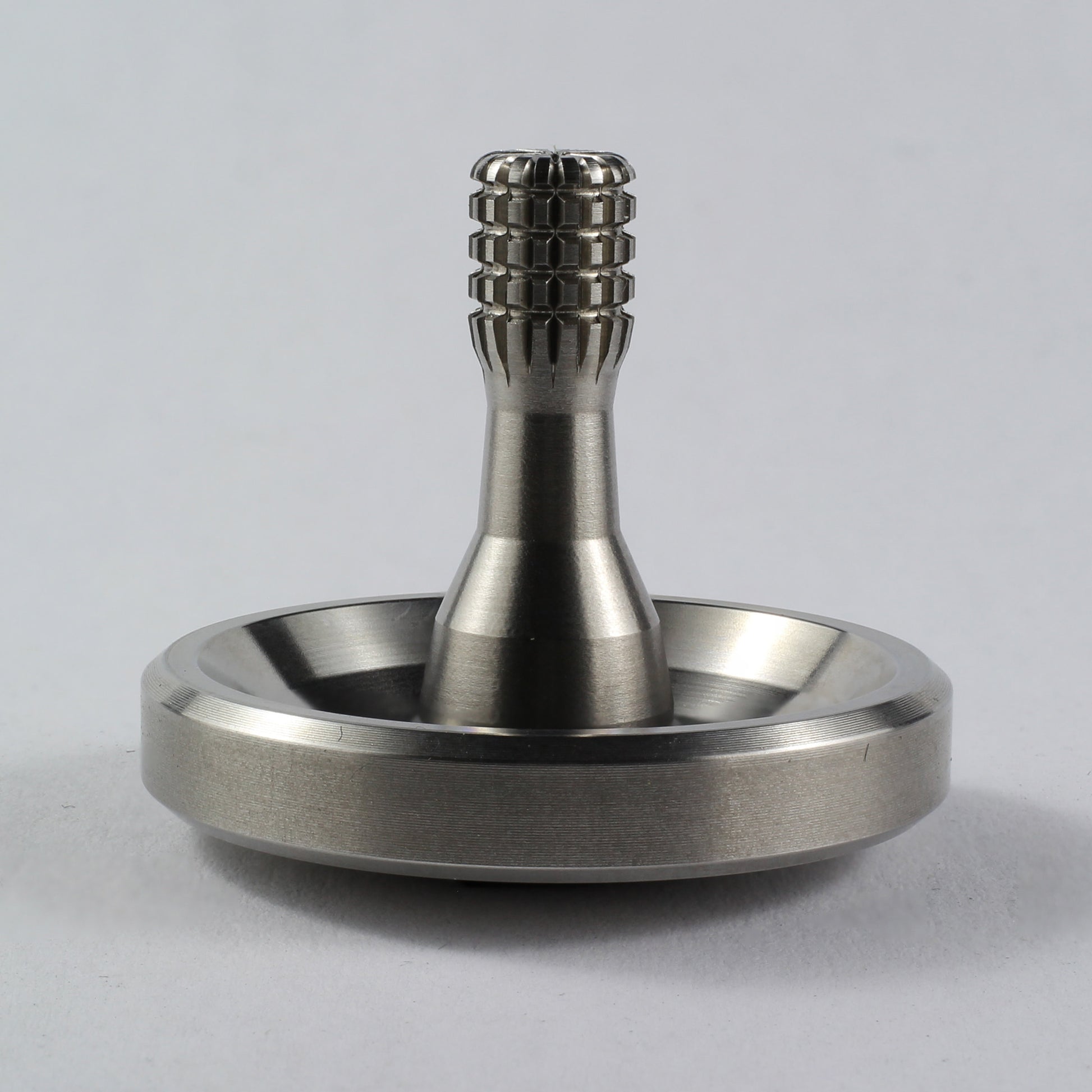Spinoff stainless steel spinning top