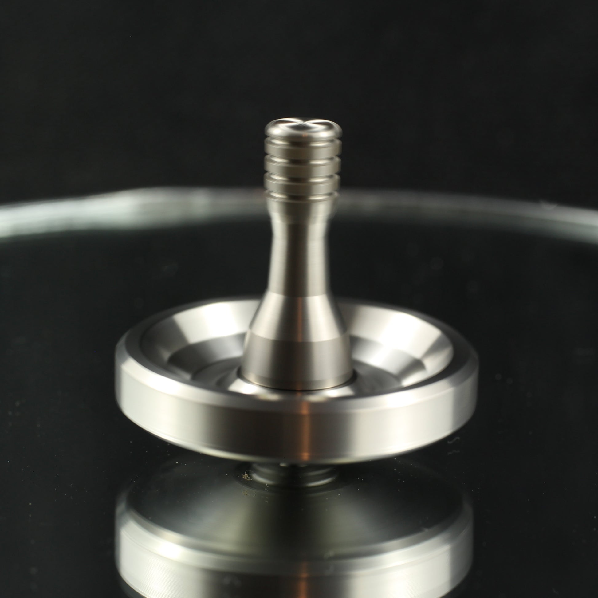 Spinoff stainless steel spinning top