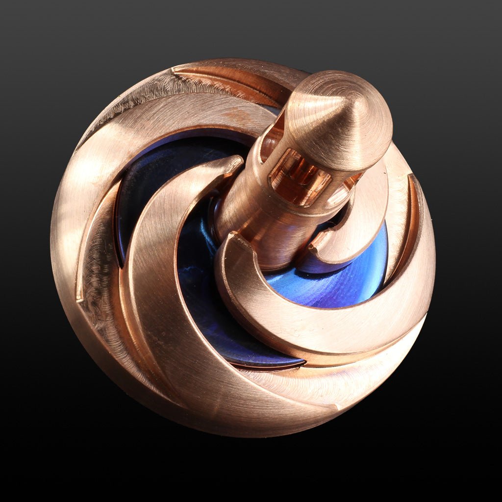 a copper and blue stainless steel Storm spinning top