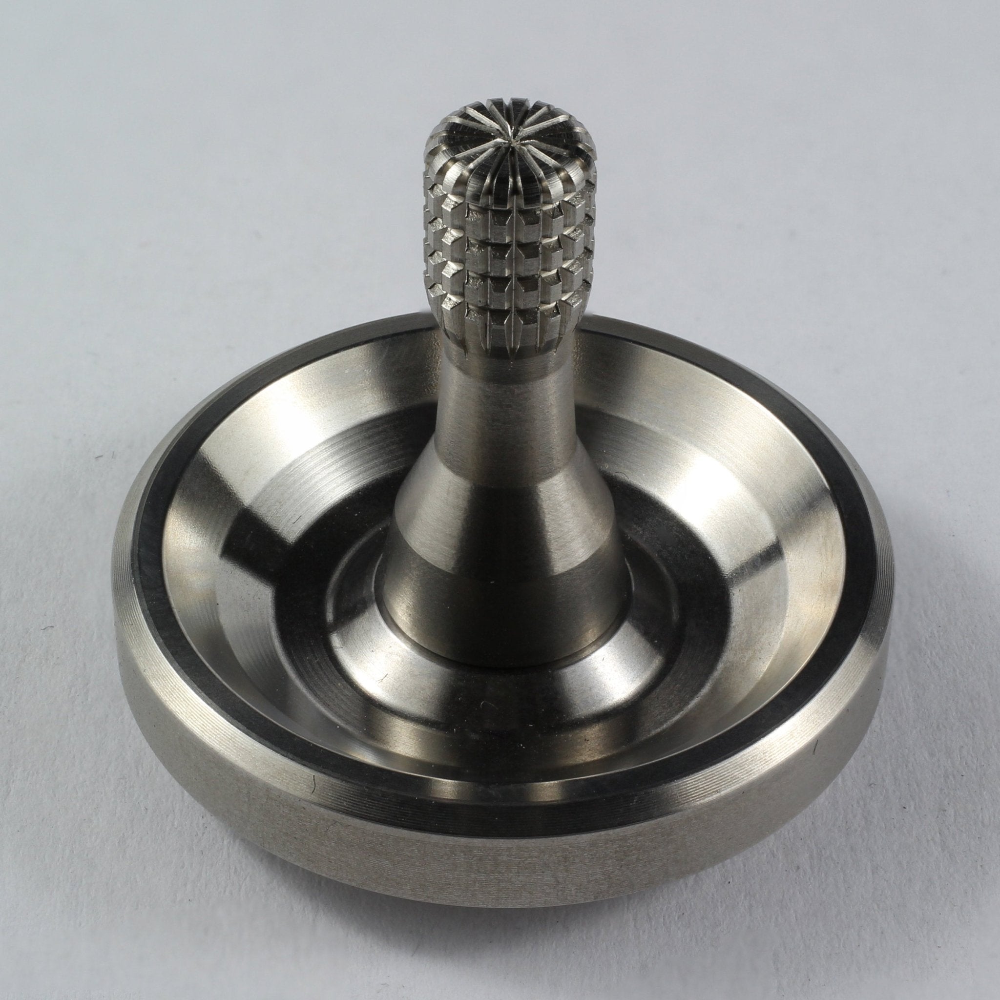 Spinoff stainless steel spinning top