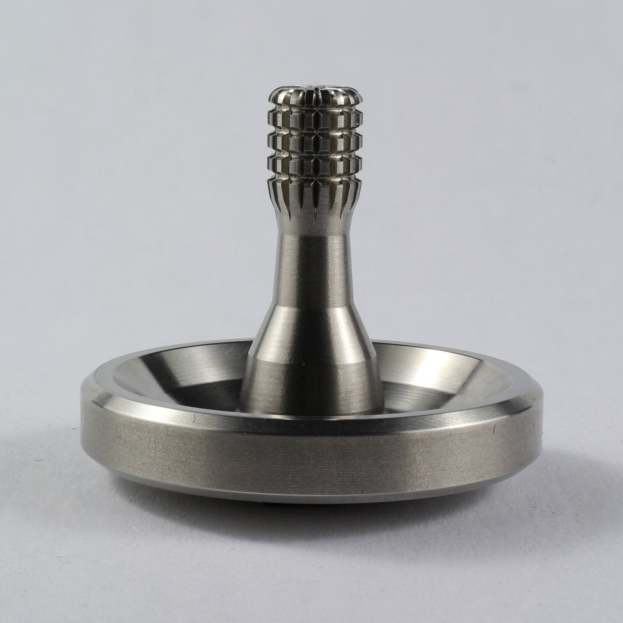 Spinoff stainless steel spinning top