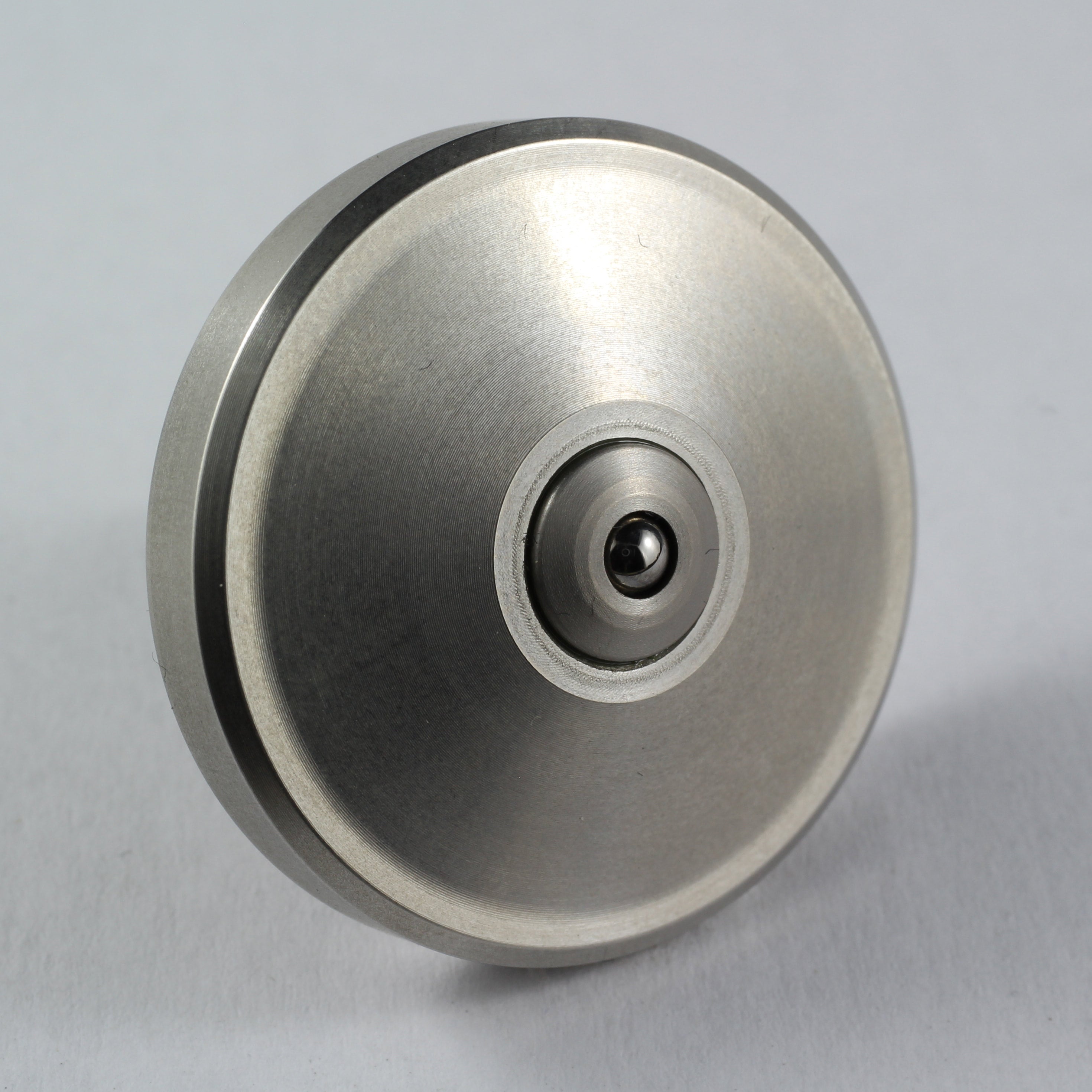 Spinoff stainless steel spinning top